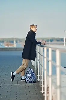 Young Man Fashion Prints: Young student with backpack in old wool coat