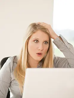 Female In Business Attire Prints: Young woman working on computer
