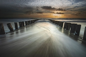 Sunset On The Coast Prints: Breakers on the North Sea beach