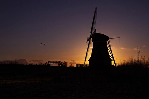 Sunset Over Water Prints: Dutch windmill