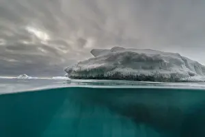 Northern Europe Wilderness Prints: An over-under view of an iceberg