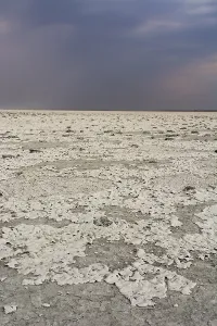 Arid Desert Landscapes Africa Prints: A storm approaching the salt pan
